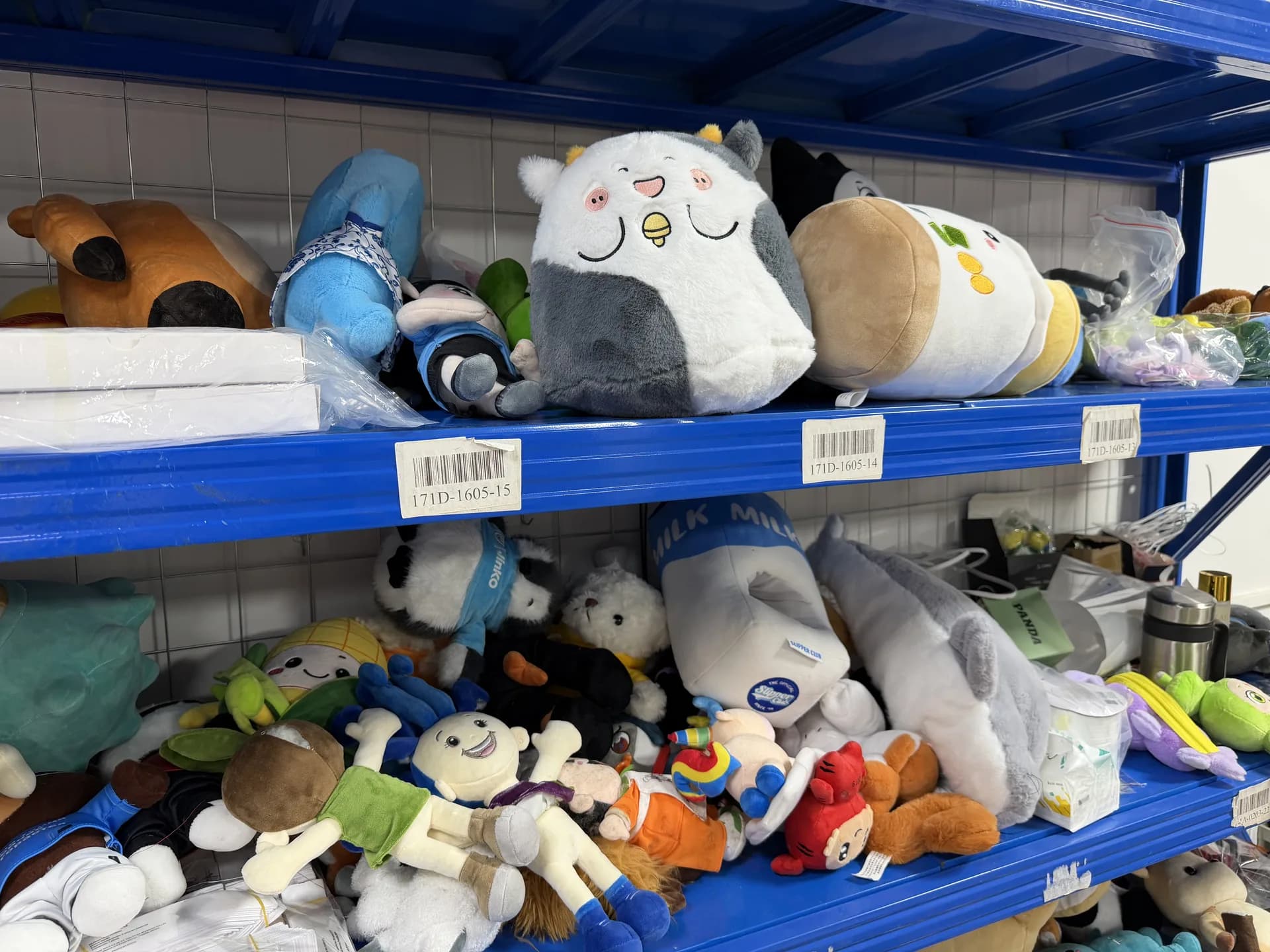 Custom plush development samples stored in the workshop