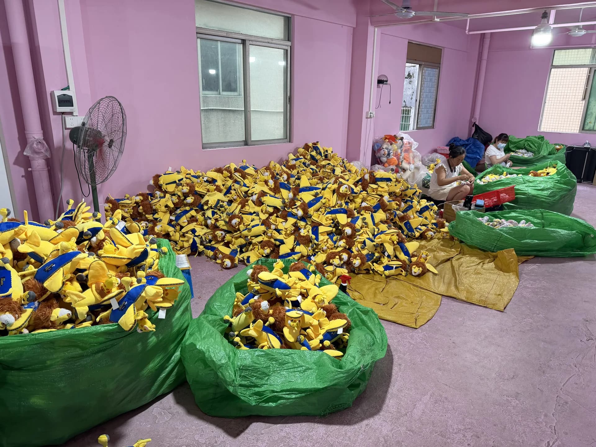 Bulk custom plush production batch ready to move into final packing and dispatch